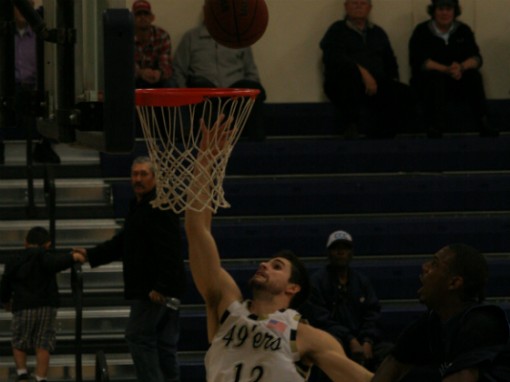 Anto Olah of the 49ers drives past a Contra Costa defender for a lay-up during the first half of their Bay Valley Conference Championship game on February 17 in Linda.  Yuba won the game, 81-67. (Photo: Chris Carpenter | The Prospector)
