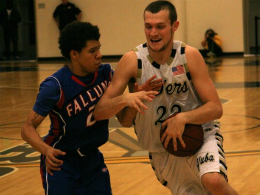 Cody Kale of the 49ers attempts to drive past West Hills College defender Arazi Simmons during the second half of their State Championship Tournament game on Saturday in Linda.  Yuba College won the game, 98-58. (Photo: Chris Carpenter | The Prospector)