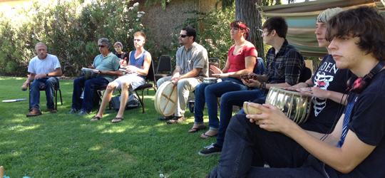 An array of age groups participating in a drum circle at Yuba College | Photo provided by Dr. Mathews