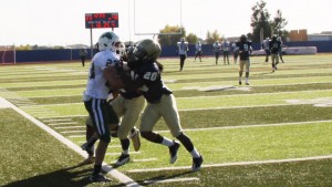 De'Arius Dow assesting on a tackle