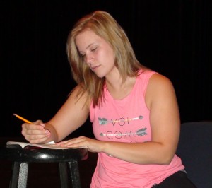 Alyssa Patterson (Dorine) studies her lines during a break