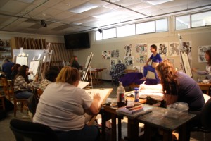 A model poses for Wallace's Painting and Drawing class.