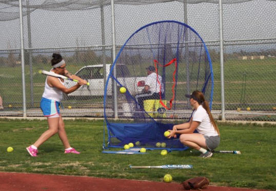 A player practices her swing.