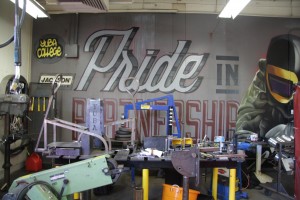 Mural in the Yuba College welding shop announces the department's pride. 