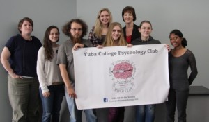 The Psychology Club shows off the club's new banner, courtesy of Professor Jensen-Martin.