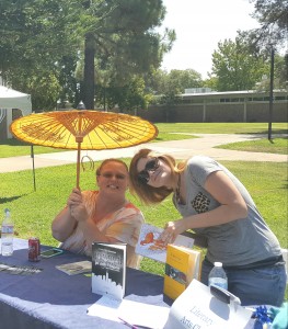 Yuba College Literary Arts Club Officers Evelyn Williamson, Secretary, left and Brenna Cariker, Activities Coordinator, right host table at Welcome Day event