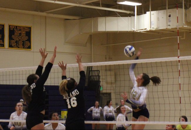Volleyball player spiking the ball