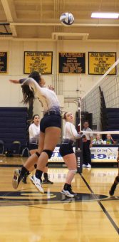 Alejandra Martinez spikes the ball on Alameda defense. 