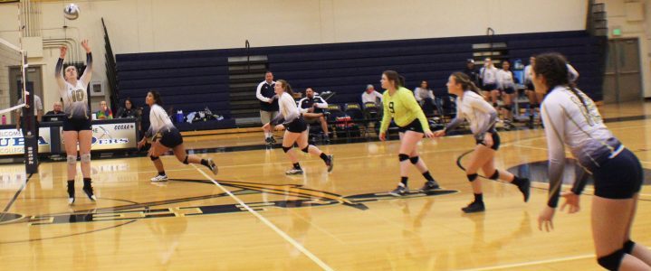 Volleyball team lined up in position for offensive attack on opponent Alameda