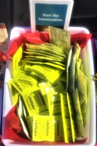 Condoms and a pamphlet about safe sex.