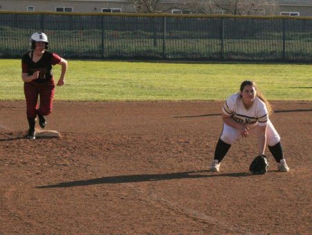Dusty Steele waits to field a ground ball with a runner on third.