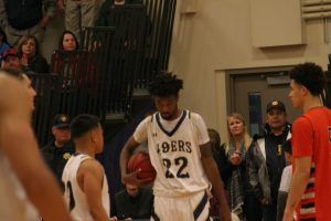 Jeryn Lucas holds the ball to run out the clock against College of the Sequoias.