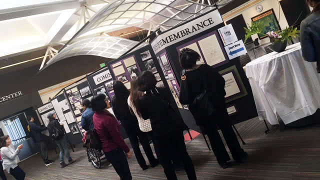 People looking at display.