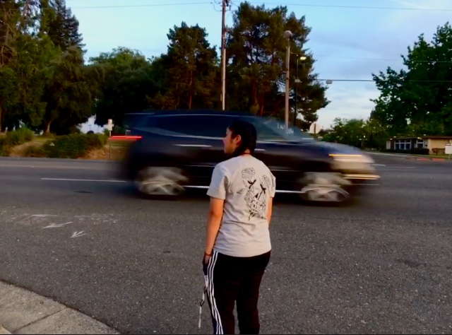 A vehicle speeds through as Angela crosses through N. Beale.