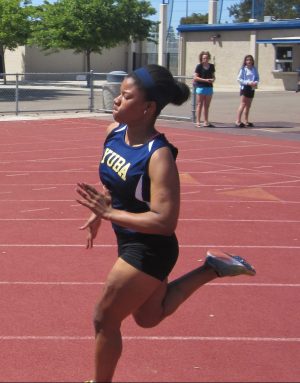 Nicole White sprinting during the April 21 track meet.