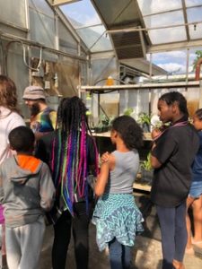 R Spot kids Checking out the plants in the greenhouse with Presley
